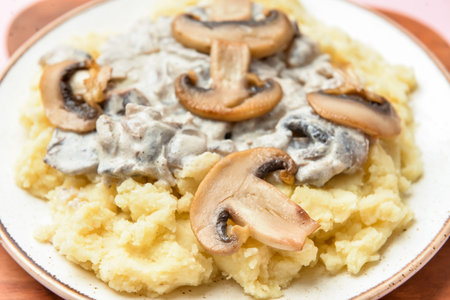 Plate with tasty mashed potatoes and mushrooms, closeupの写真素材