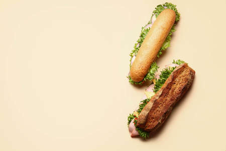Tasty sandwiches on color backgroundの写真素材