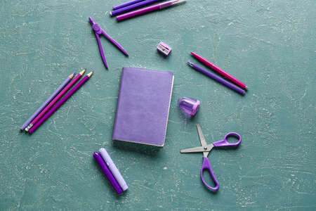 Stationery supplies on color background