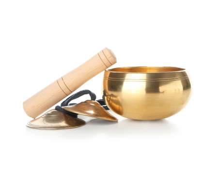 Tibetan singing bowl with karatalas on white background