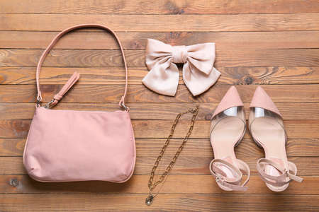 Stylish female accessories on wooden backgroundの写真素材