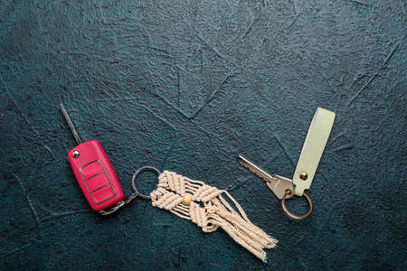 Keys with keychains on dark background