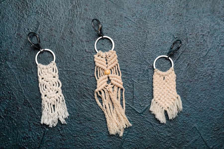 Handmade cotton keychains on dark background
