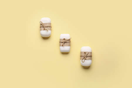 Soap bars on color background