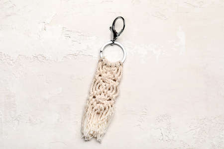 Handmade cotton keychain on light background