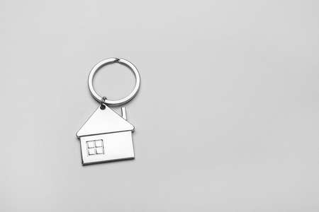 house shape keychain on gray backgroundの写真素材