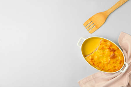 Casserole with mashed potatoes on light background