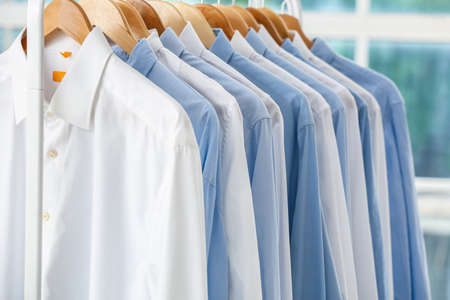 Rack with clean shirts after dry-cleaning