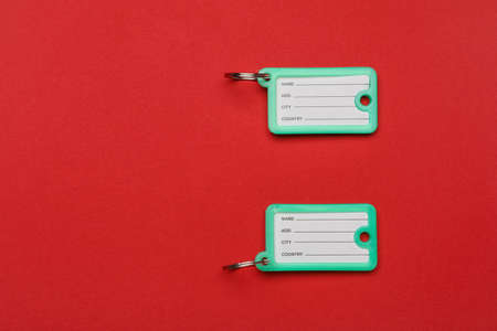 Plastic key tags on color backgroundの写真素材