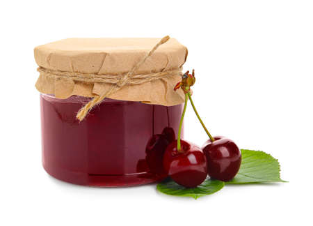 Jar of tasty cherry jam on white backgroundの写真素材