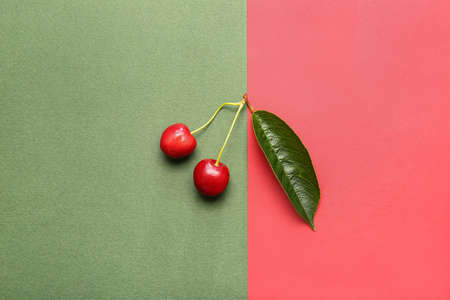 Tasty ripe cherry on color backgroundの写真素材