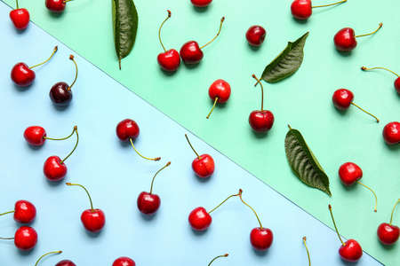 Tasty ripe cherry on color background