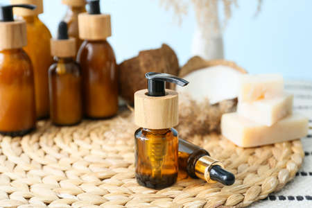 Bottles of natural essential oil on table, closeup