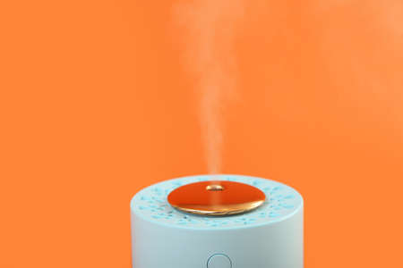 Modern humidifier on color backgroundの写真素材