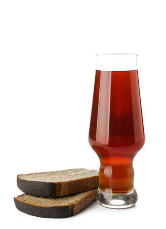 Glass of fresh kvass and bread on white backgroundの写真素材
