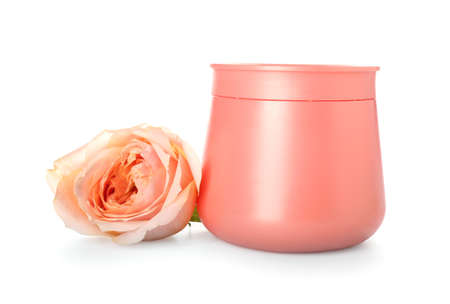 Jar of cosmetic product and rose flower on white backgroundの写真素材