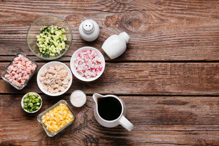 Different ingredients for okroshka on wooden backgroundの写真素材