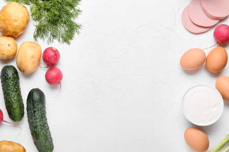 Different ingredients for okroshka on light background