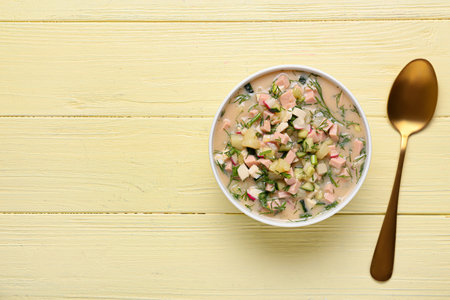 Bowl with tasty okroshka on color wooden backgroundの写真素材