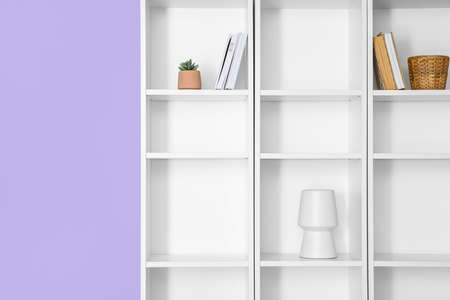 Modern shelf unit near color wall