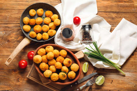 Composition with fried potato balls on wooden backgroundの写真素材