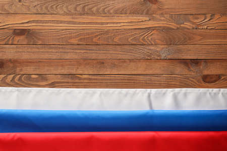 Russian flag on wooden background, closeupの写真素材