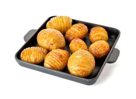Dish with baked potato on white background