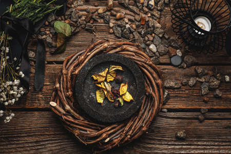 Mortar with ingredients for witch's ritual on wooden backgroundの写真素材