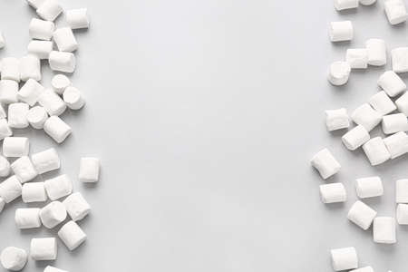 Tasty marshmallows on light background