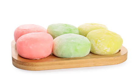 Board with delicious mochi on white backgroundの写真素材