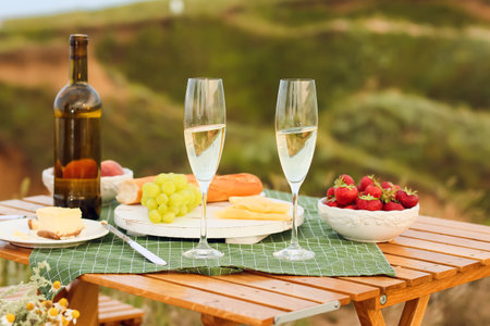 Table set for romantic picnic outdoorsの写真素材