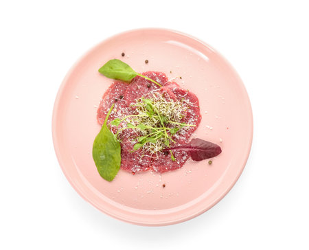 Plate with tasty veal carpaccio on white backgroundの写真素材