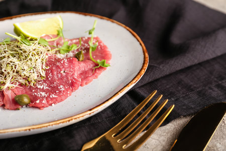 Plate with tasty veal carpaccio on table, closeupの写真素材