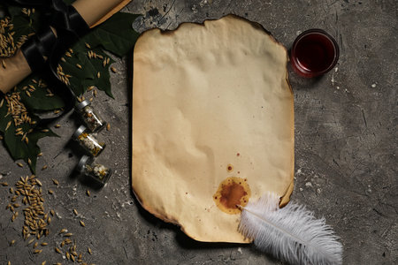 Ancient blank scroll and magic attributes for ritual on wizard table backgroundの写真素材