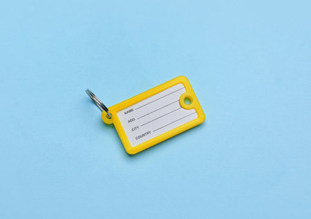 Plastic key tag on blue background