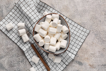 Bowl with tasty marshmallows on light backgroundの写真素材