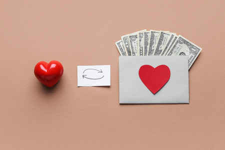 Red heart, money and paper with exchange symbol on color background. Donation conceptの写真素材