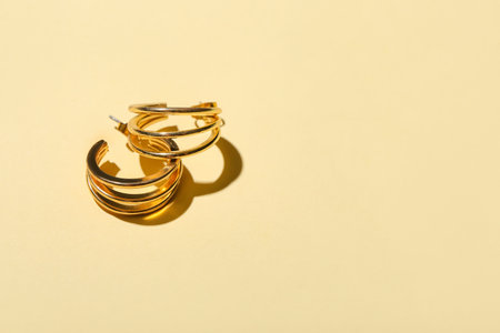 Stylish earrings on color backgroundの写真素材