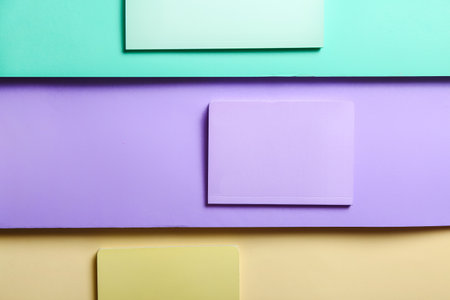 Stylish notebooks on color background