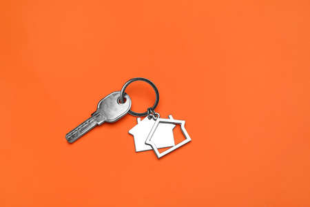 Key with keychain on orange background