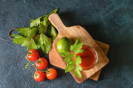 Boards with glass of bloody mary on dark backgroundの写真素材
