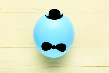 Creative balloon on color wooden backgroundの写真素材