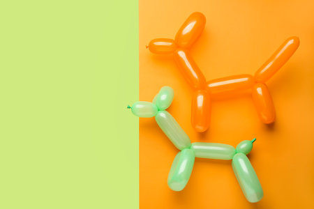 Dogs made of balloons on color backgroundの写真素材