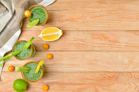 Glasses of bloody Mary cocktail on wooden backgroundの写真素材