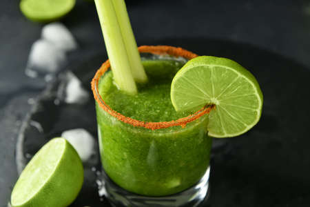 Glass of bloody Mary cocktail on dark backgroundの写真素材