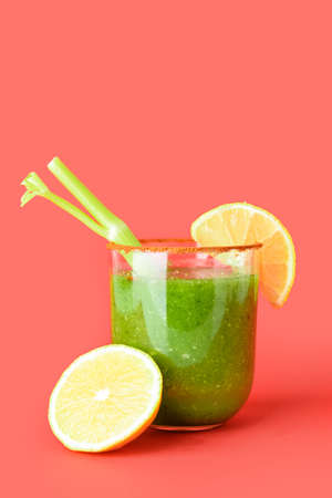 Glass of bloody Mary cocktail on color backgroundの写真素材