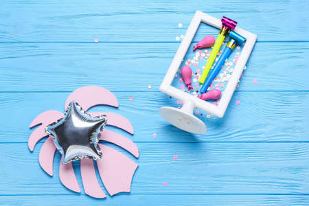 Star shaped balloon with festive decor on color wooden background