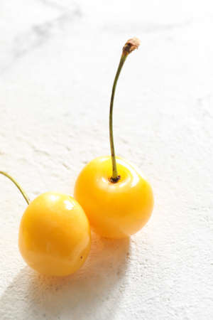 Tasty sweet cherry on light background