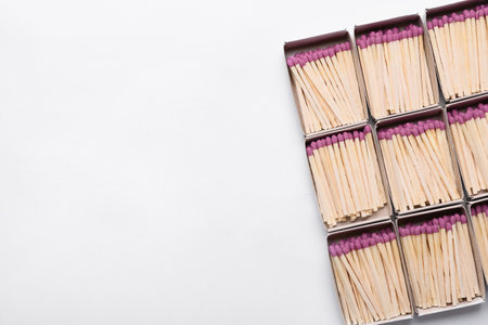 Boxes with whole matches on light background, closeup