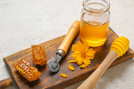Composition with sweet honey on light background
